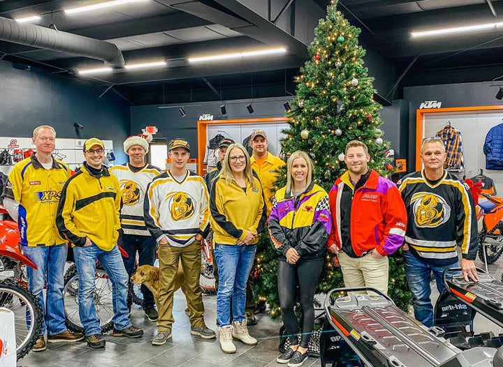 Group picture in our dealership. We are all wearing vintage Ski-Doo gear! Pictured: Rob Strauss, Morgan Strauss, Taylor Struass and more! 